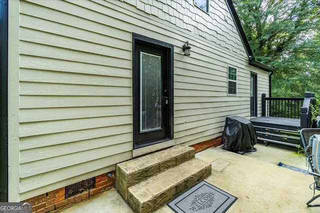 a view of an house with backyard porch and sitting area