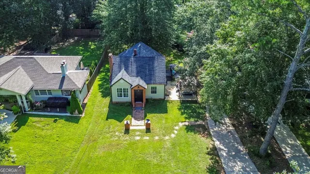 a aerial view of a house with swimming pool