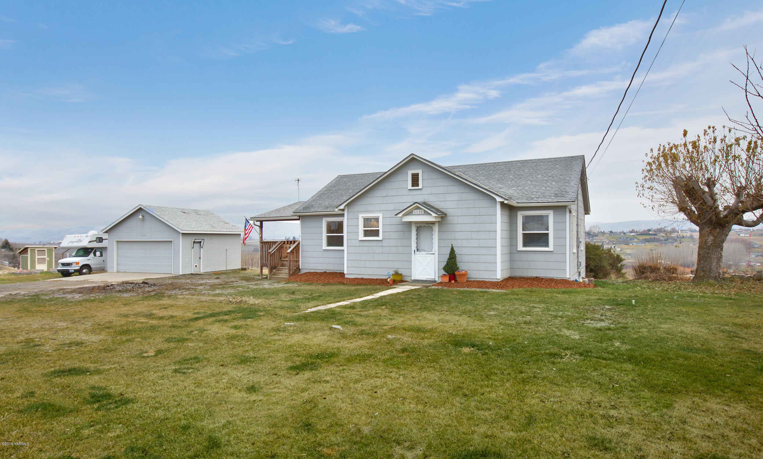 11130 Estes Road Yakima, WA 98908 - Photo 2 of 16 a view of a house with a yard