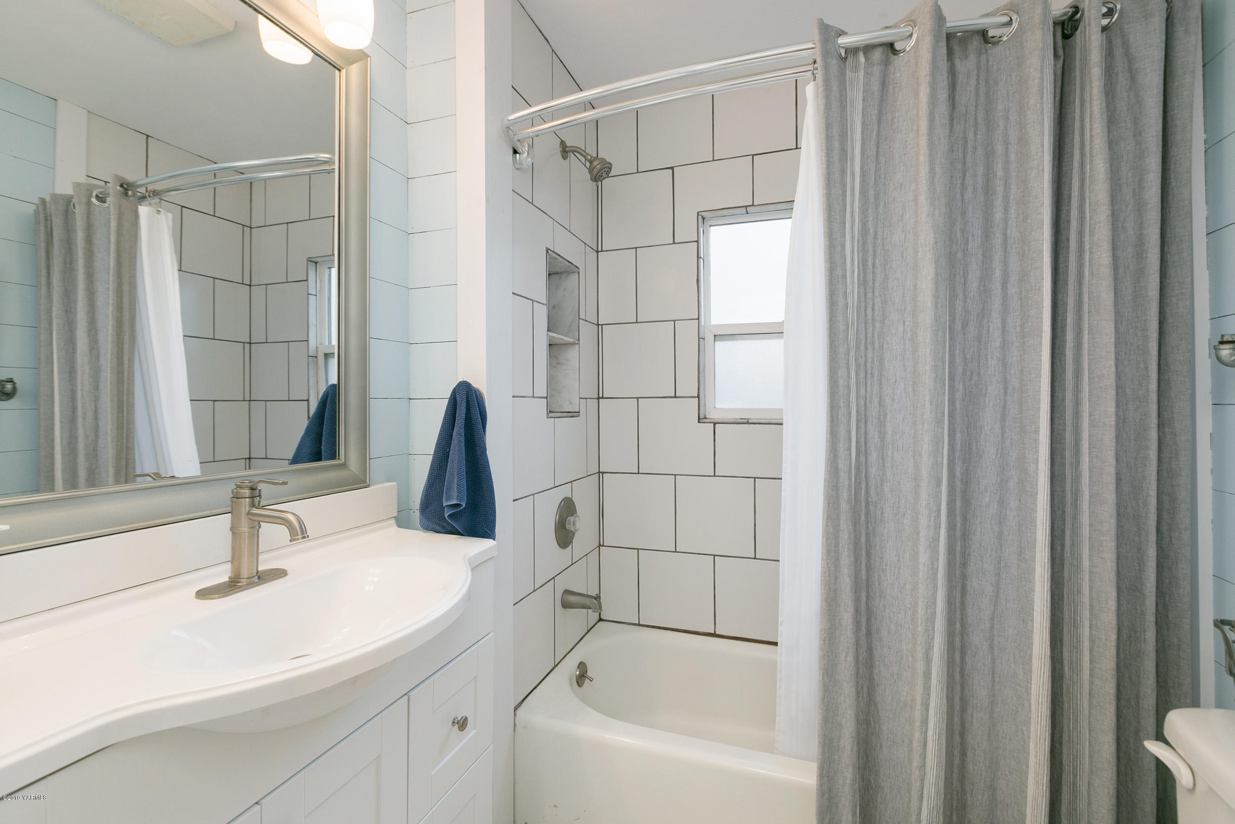 11130 Estes Road Yakima, WA 98908 - Photo 11 of 16 a bathroom with a sink and a shower