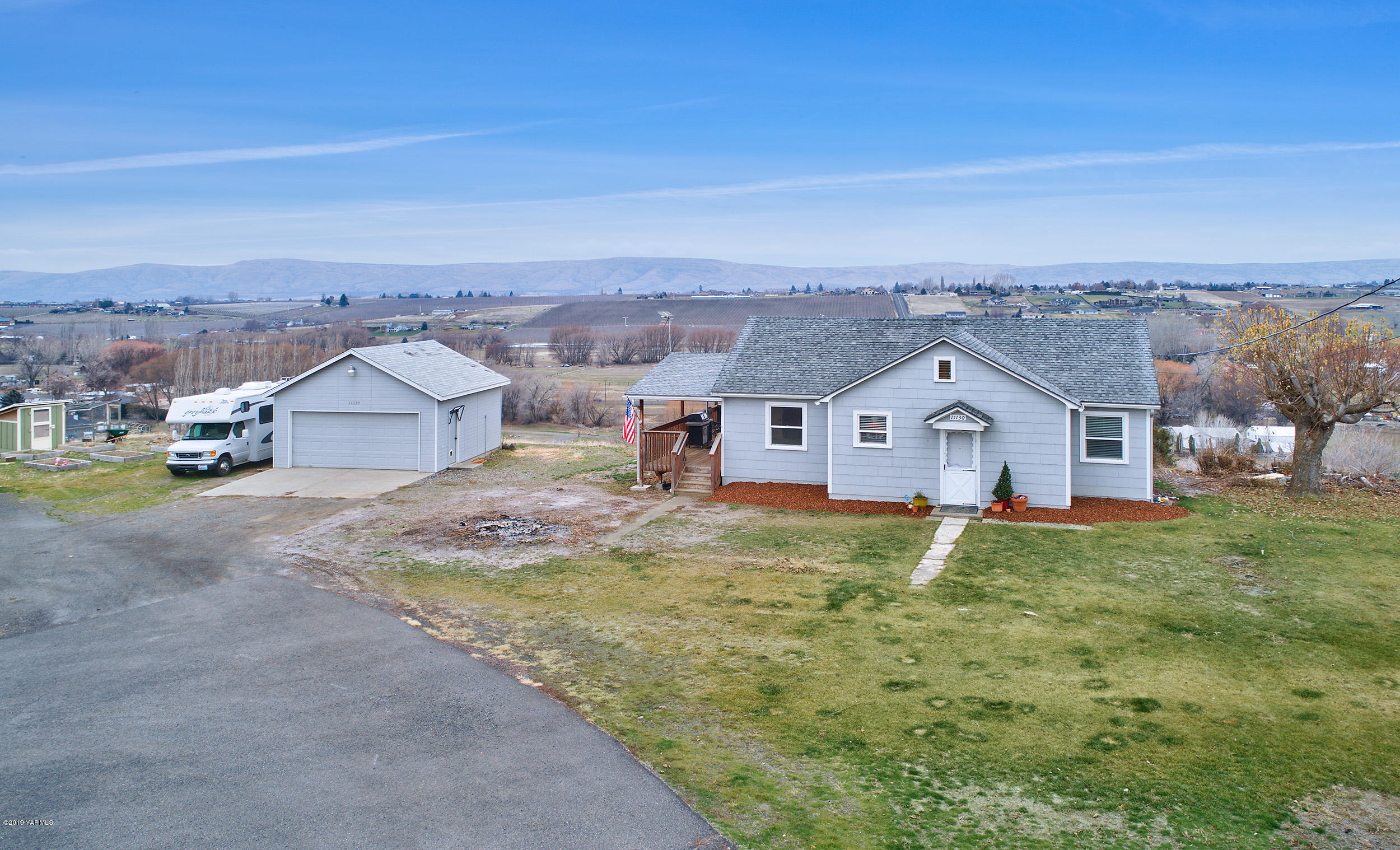 11130 Estes Road Yakima, WA 98908 - Photo 14 of 16 an aerial view of residential houses with outdoor space and trees