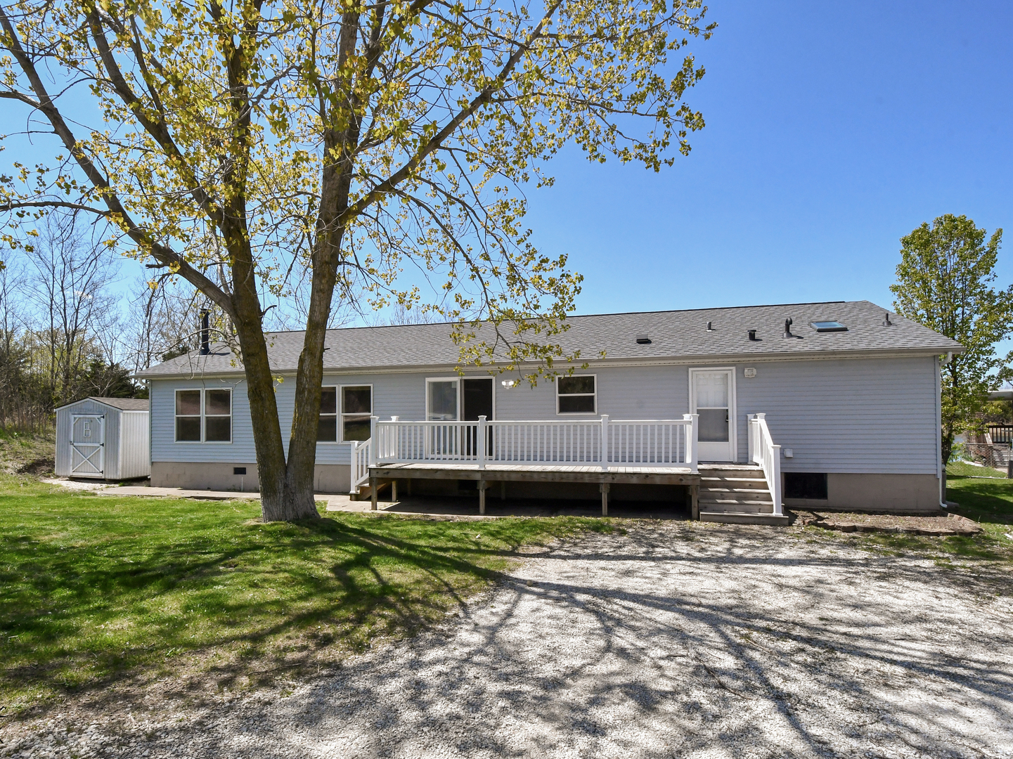 18530 West 3000N Road Reddick, IL 60961 - Photo 11 of 40 a front view of a house with a yard and garage