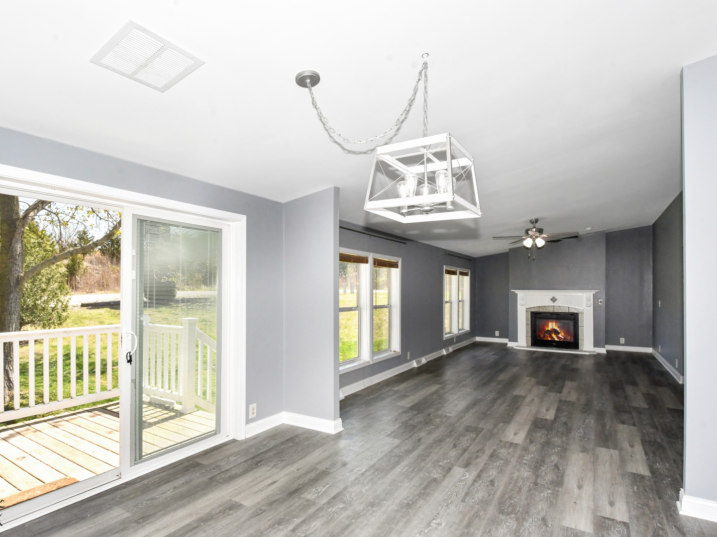 18530 West 3000N Road Reddick, IL 60961 - Photo 12 of 40 a view of a livingroom with wooden floor a fireplace