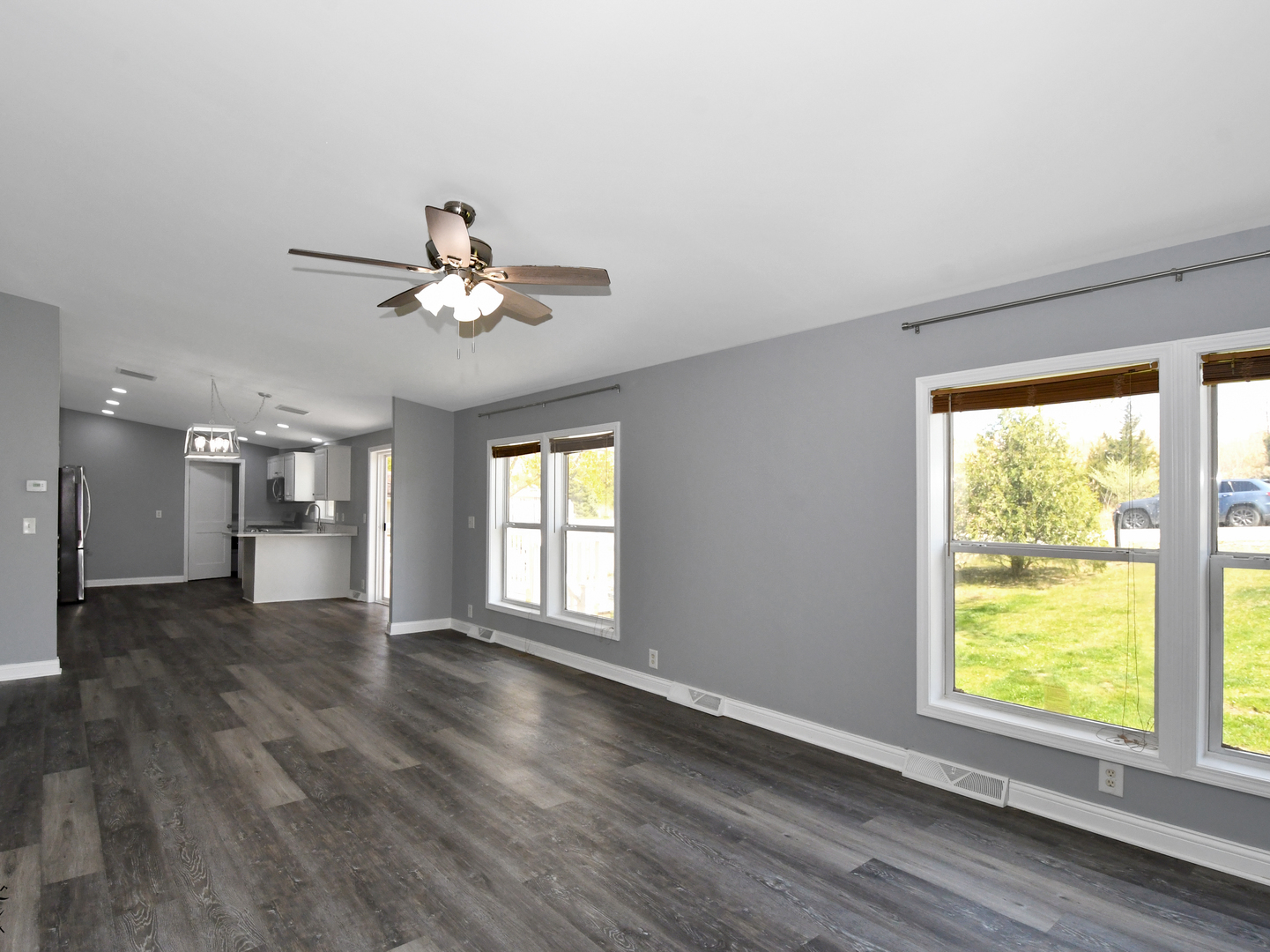 18530 West 3000N Road Reddick, IL 60961 - Photo 14 of 40 a view of an empty room with a window and wooden floor