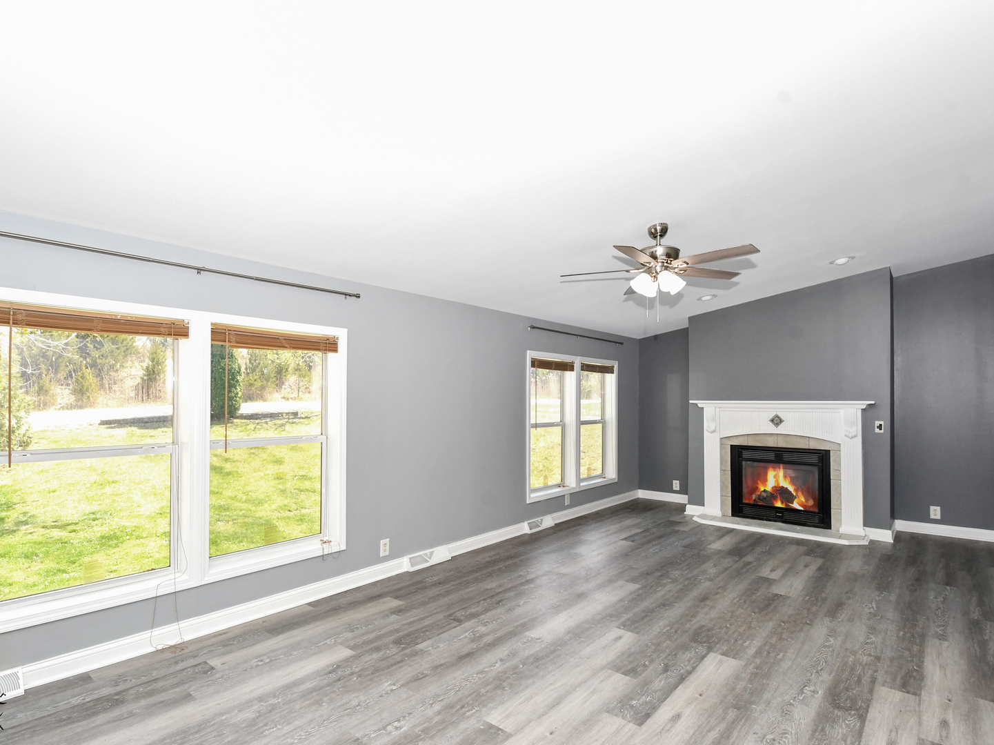 18530 West 3000N Road Reddick, IL 60961 - Photo 15 of 40 a view of an empty room with a fireplace and a window