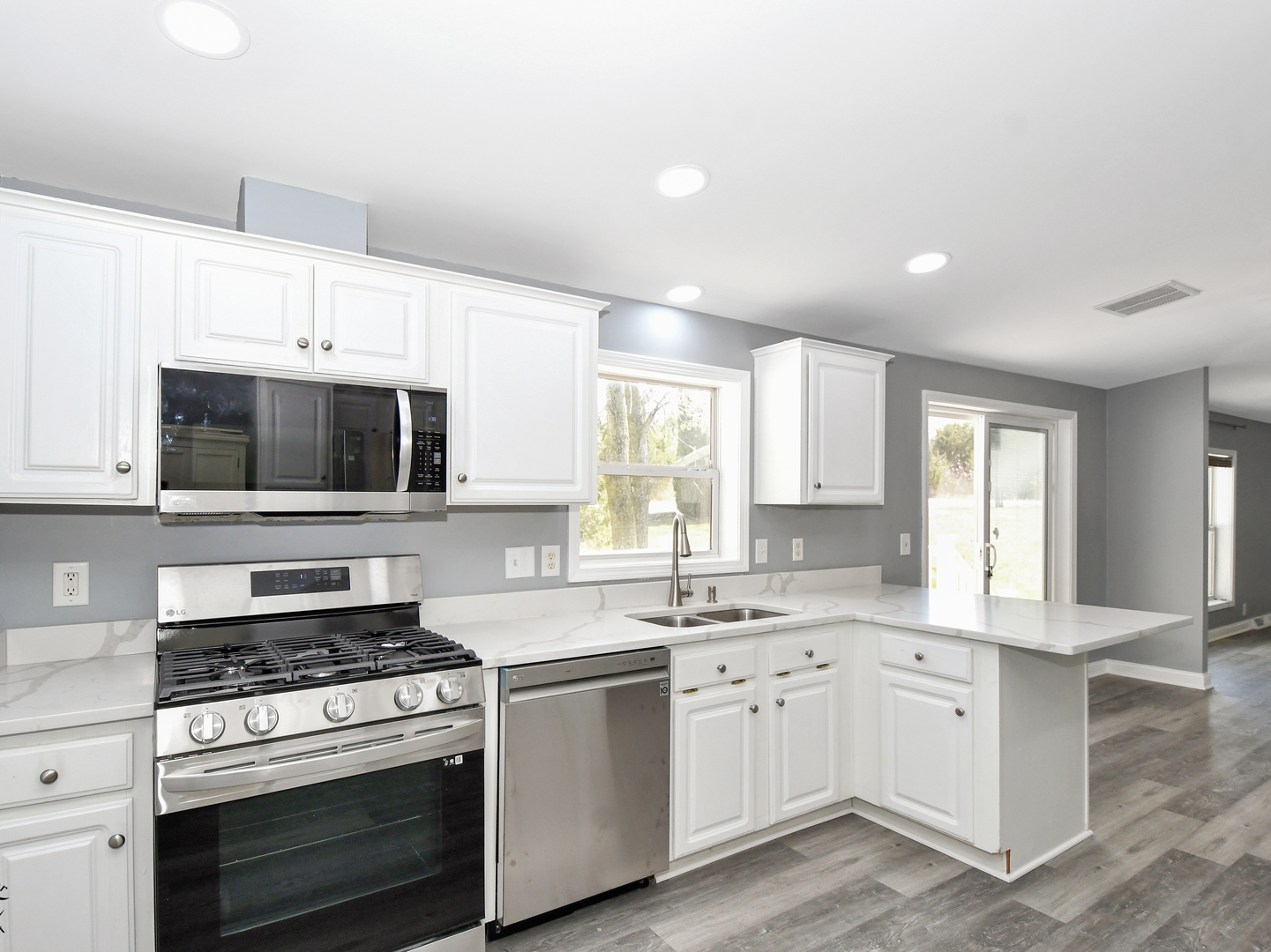 18530 West 3000N Road Reddick, IL 60961 - Photo 18 of 40 a kitchen with white cabinets and appliances