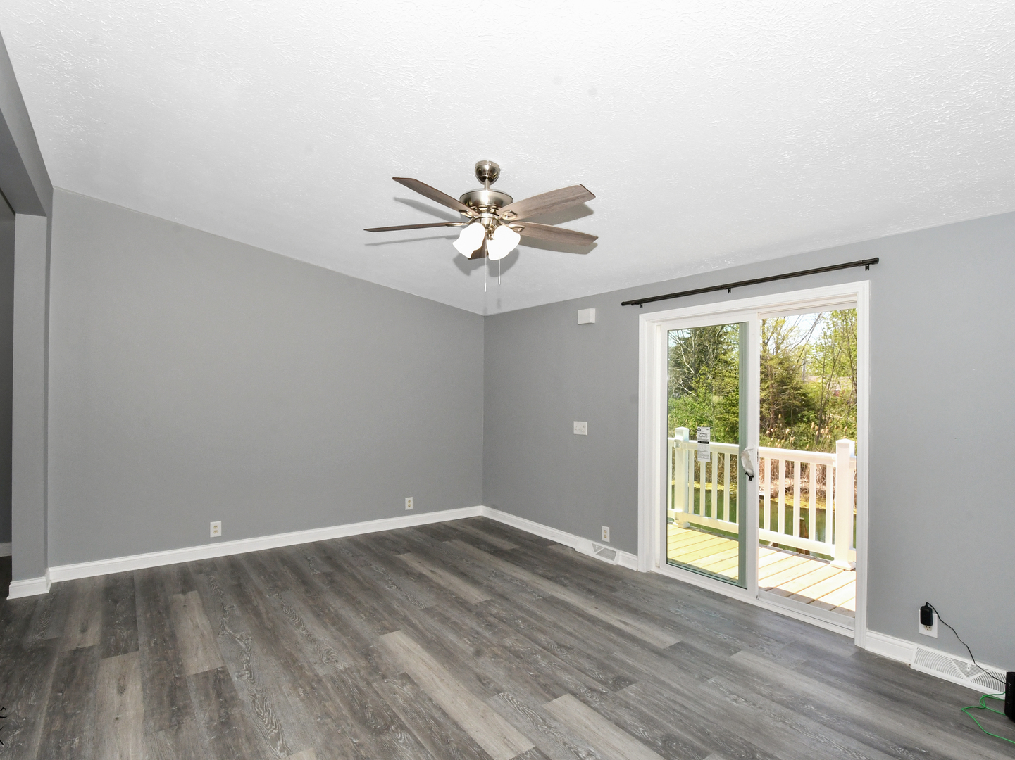 18530 West 3000N Road Reddick, IL 60961 - Photo 21 of 40 a view of an empty room with wooden floor and a window