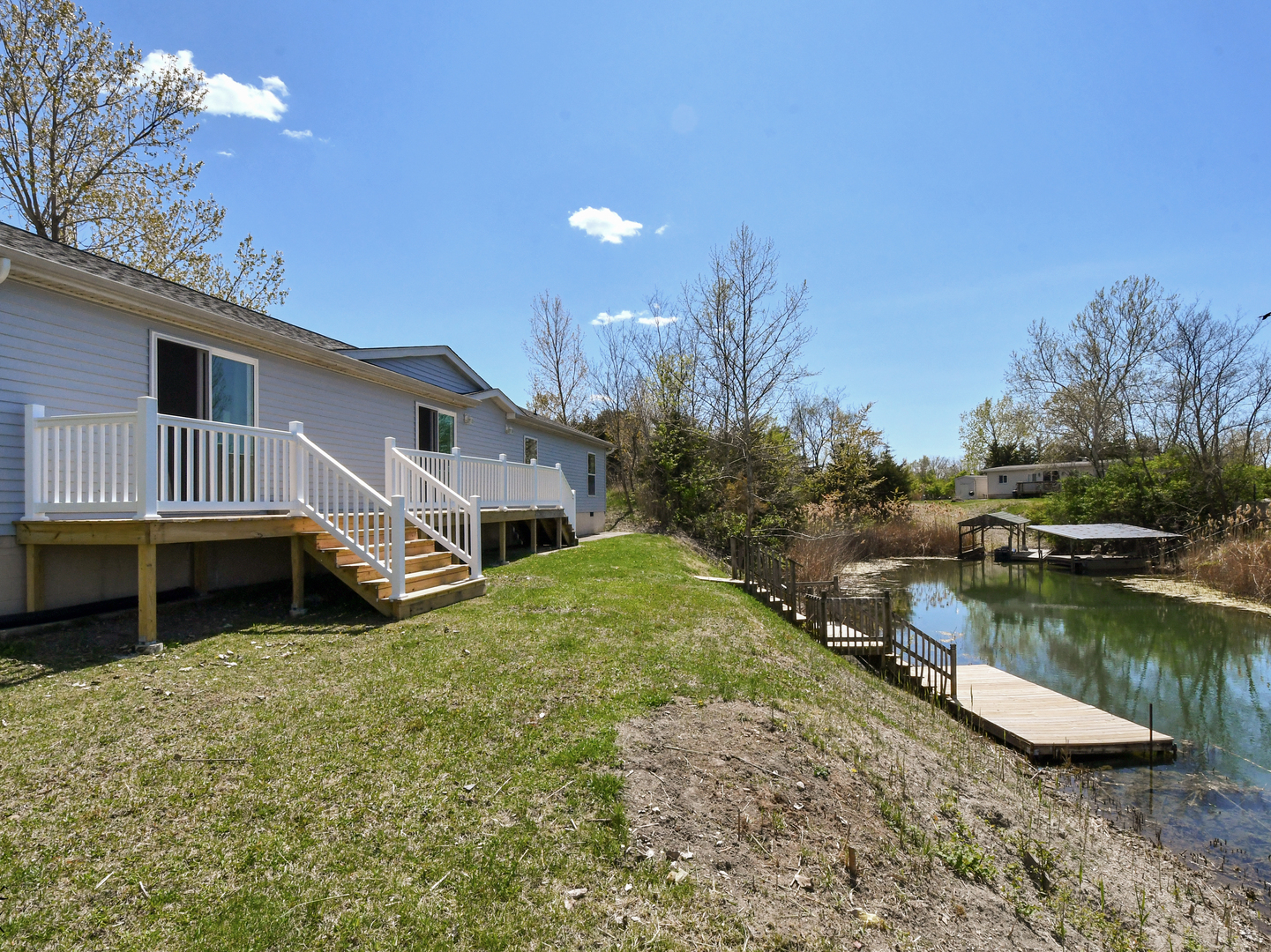 18530 West 3000N Road Reddick, IL 60961 - Photo 35 of 40 a house view with a lake view