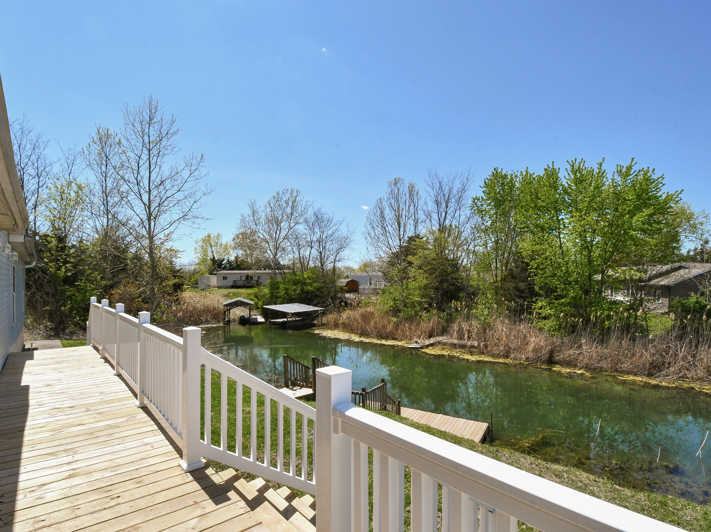 18530 West 3000N Road Reddick, IL 60961 - Photo 36 of 40 a balcony with wooden floor and lake view