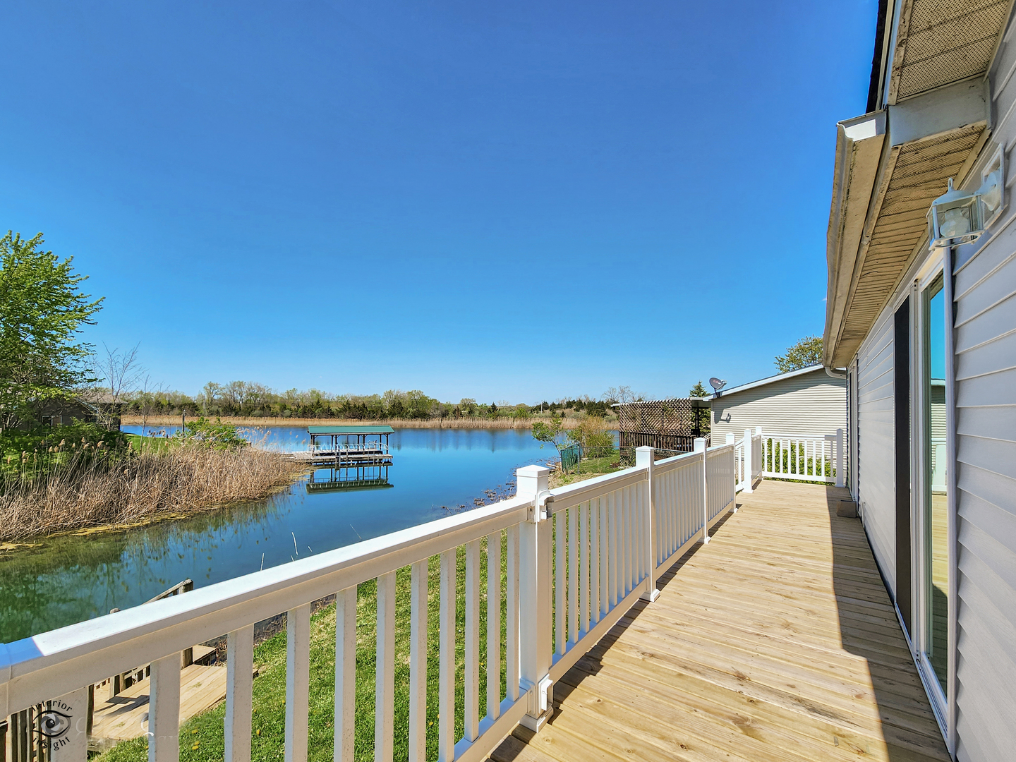 18530 West 3000N Road Reddick, IL 60961 - Photo 37 of 40 a view of a lake with a floor to ceiling window