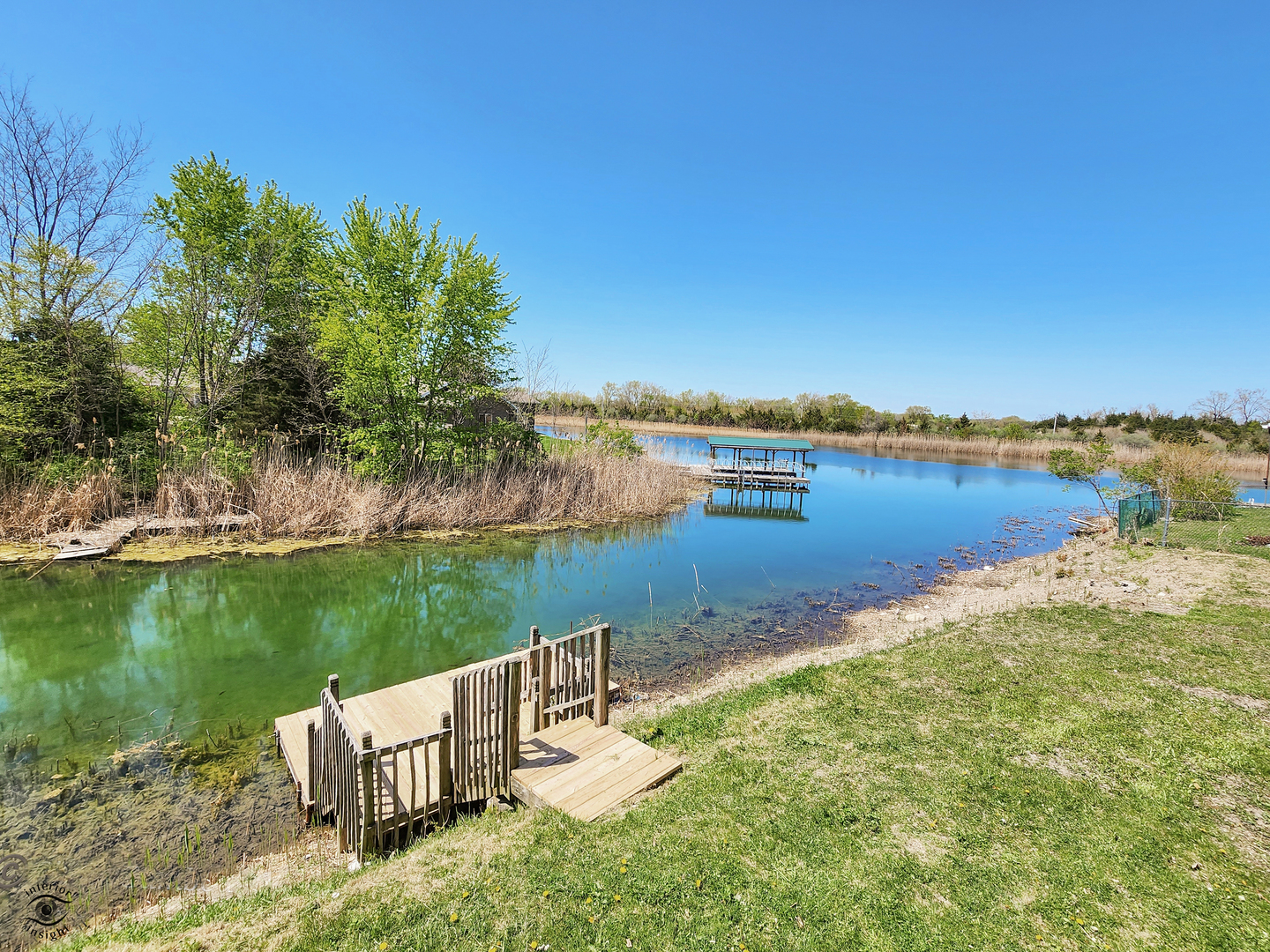 18530 West 3000N Road Reddick, IL 60961 - Photo 38 of 40 a view of a lake with houses in outdoor space