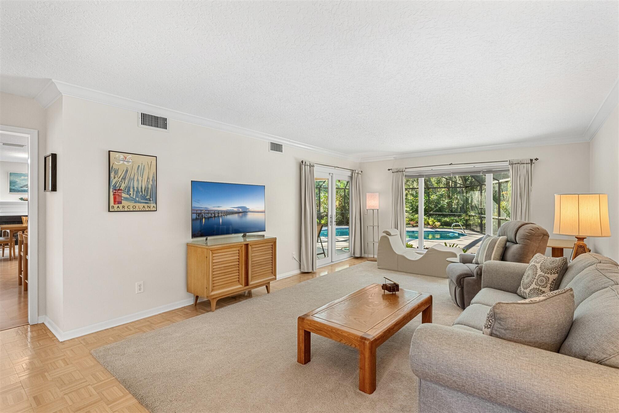 3660 Brennan Drive Melbourne, FL 32934 - Photo 11 of 71 a living room with furniture and a window