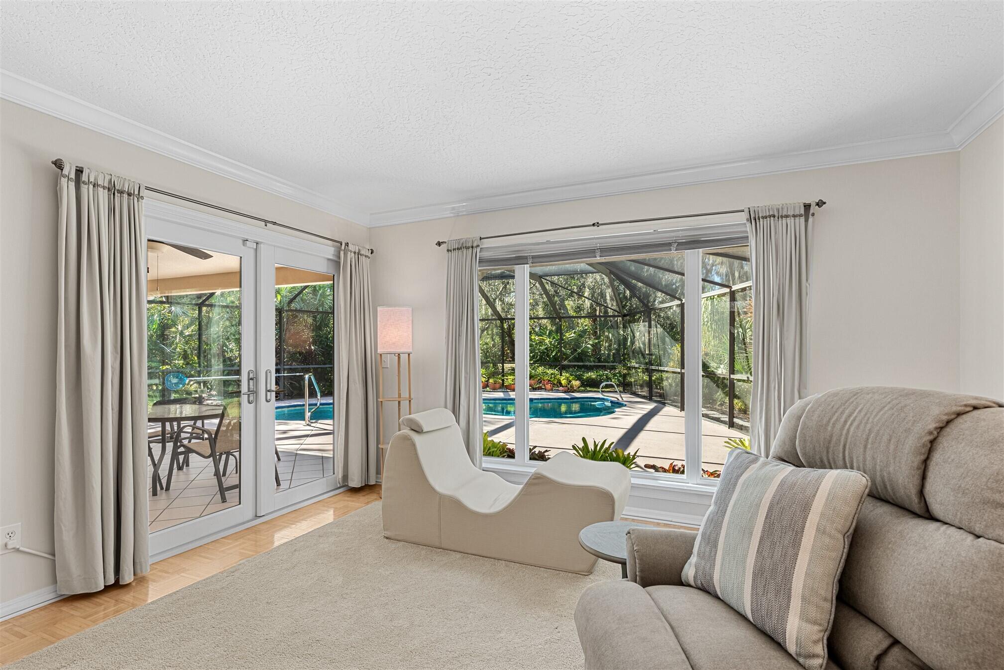 3660 Brennan Drive Melbourne, FL 32934 - Photo 12 of 71 a living room with furniture and a large window