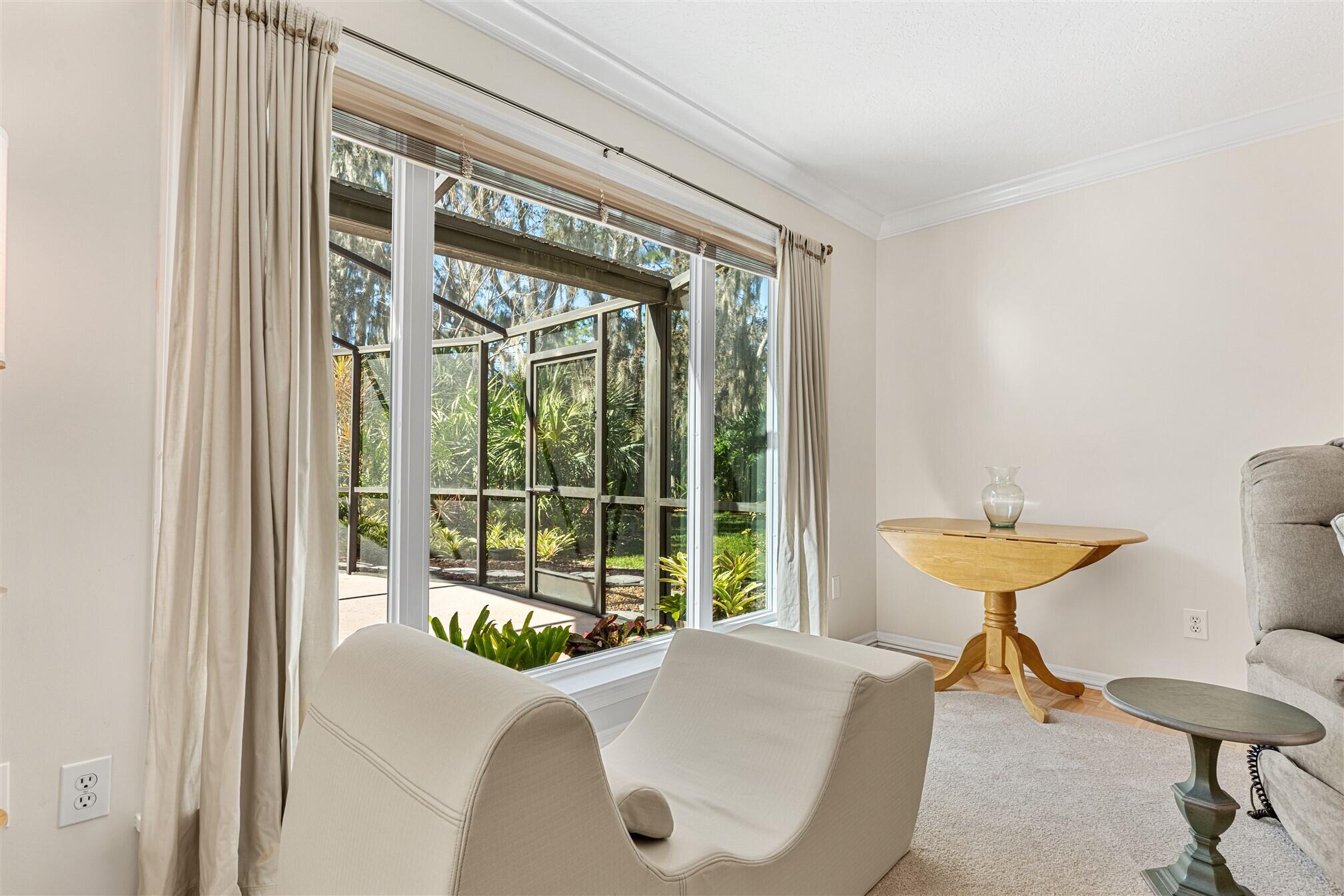 3660 Brennan Drive Melbourne, FL 32934 - Photo 13 of 71 a living room with furniture and a large window