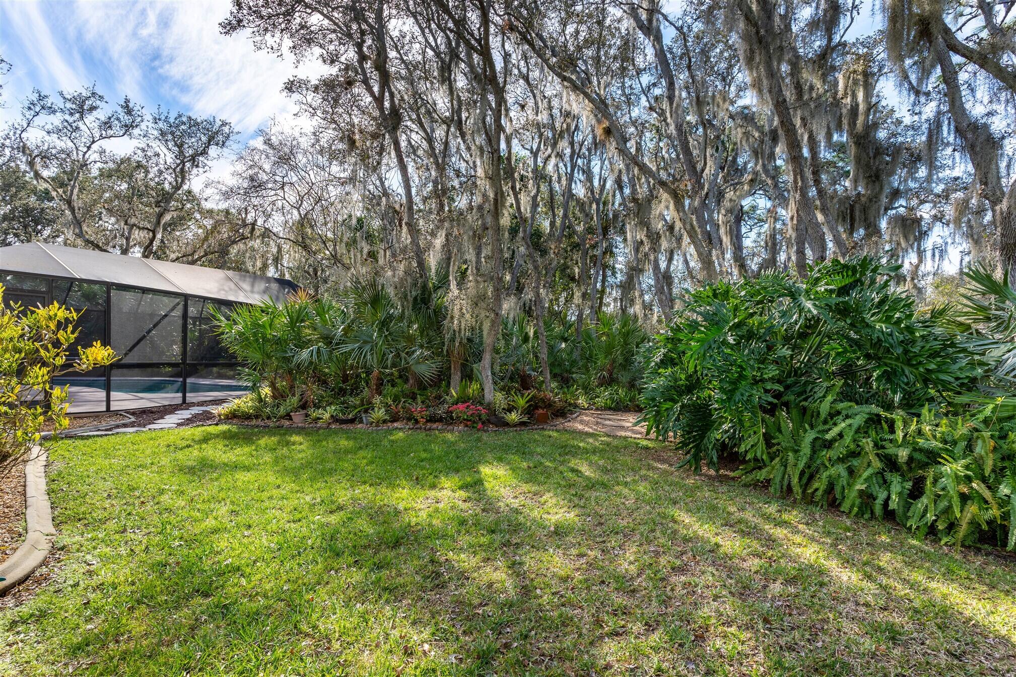 3660 Brennan Drive Melbourne, FL 32934 - Photo 52 of 71 a view of a backyard with a garden