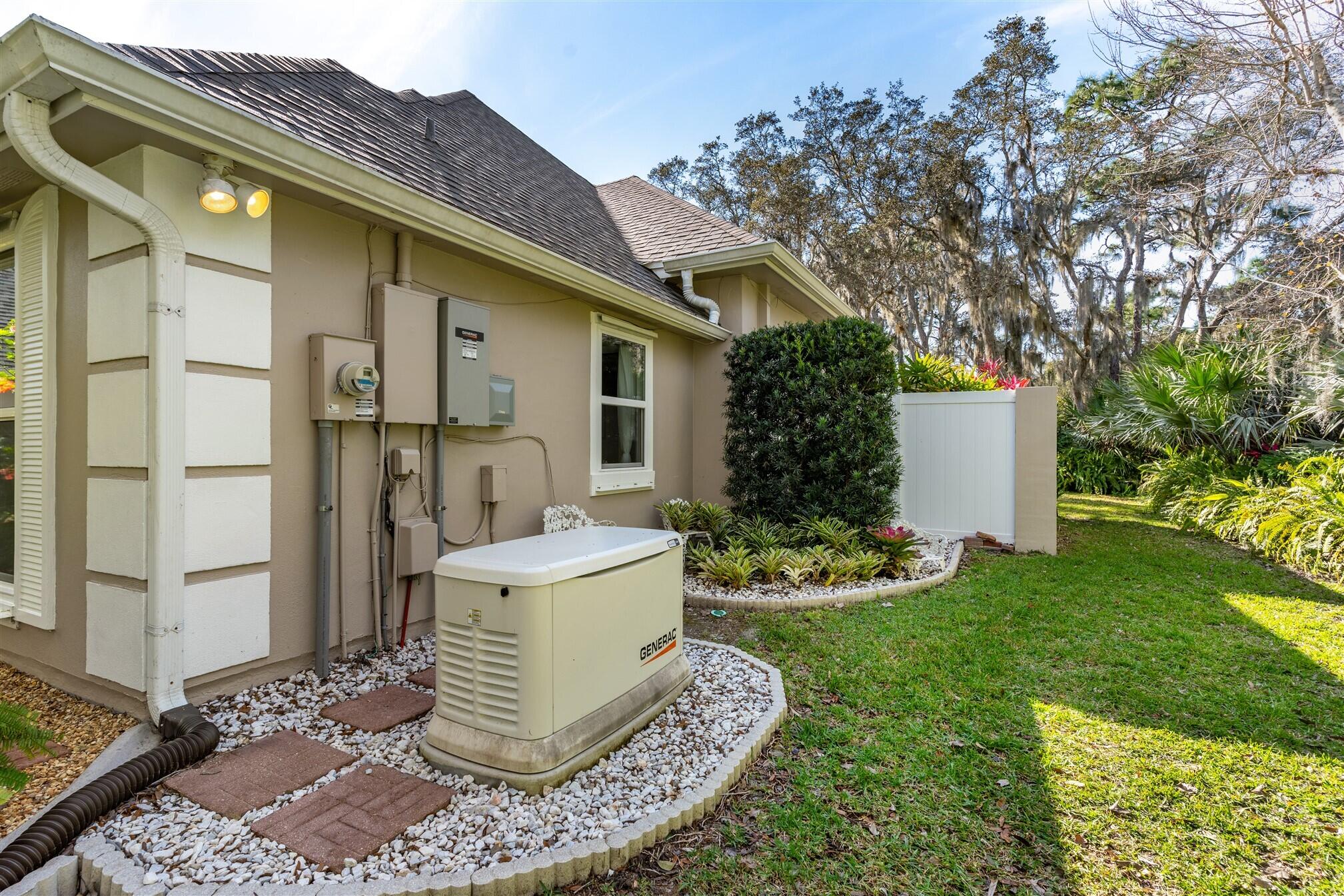 3660 Brennan Drive Melbourne, FL 32934 - Photo 6 of 71 a white house with a yard and potted plants