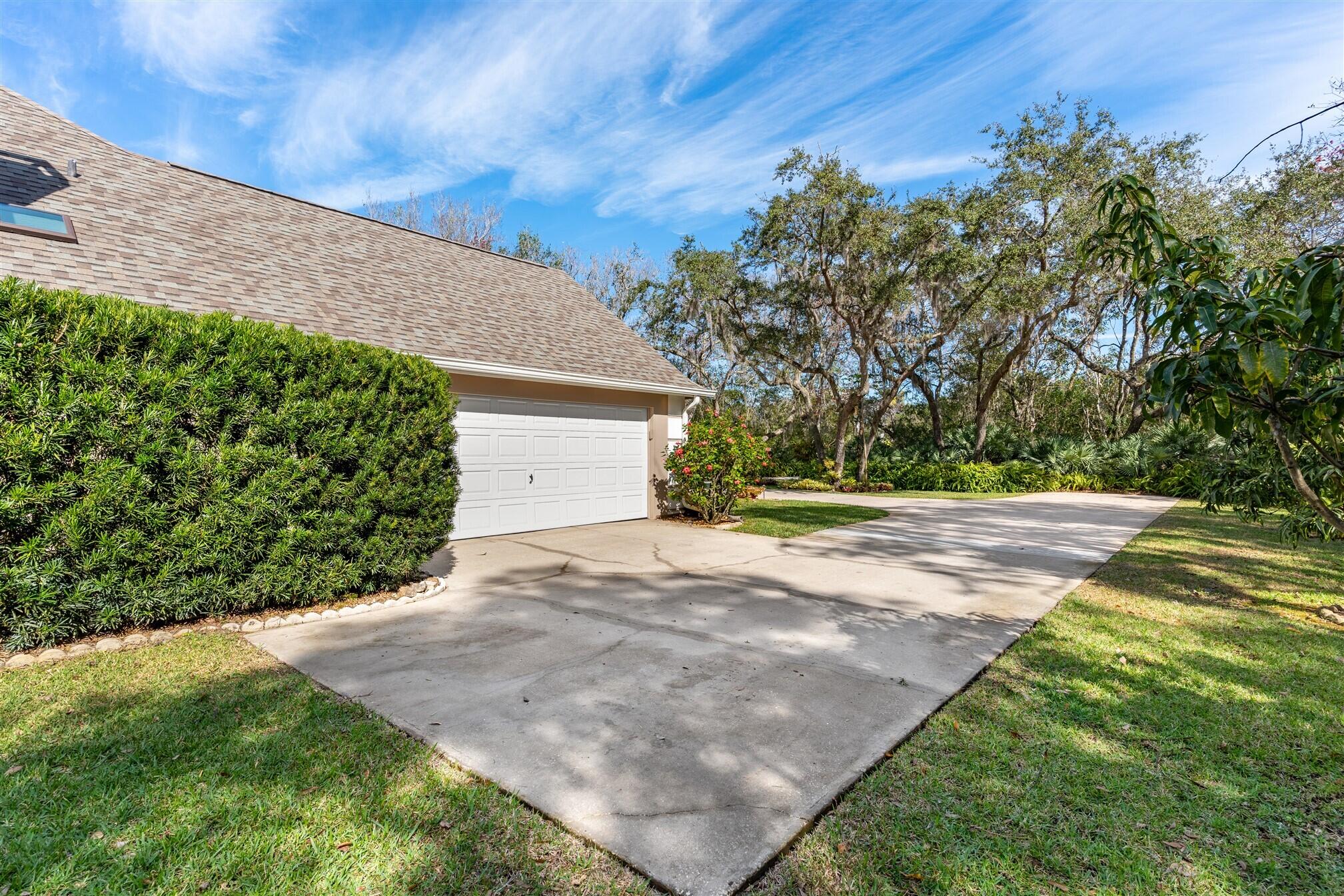 3660 Brennan Drive Melbourne, FL 32934 - Photo 62 of 71 a view of a yard with plants and trees
