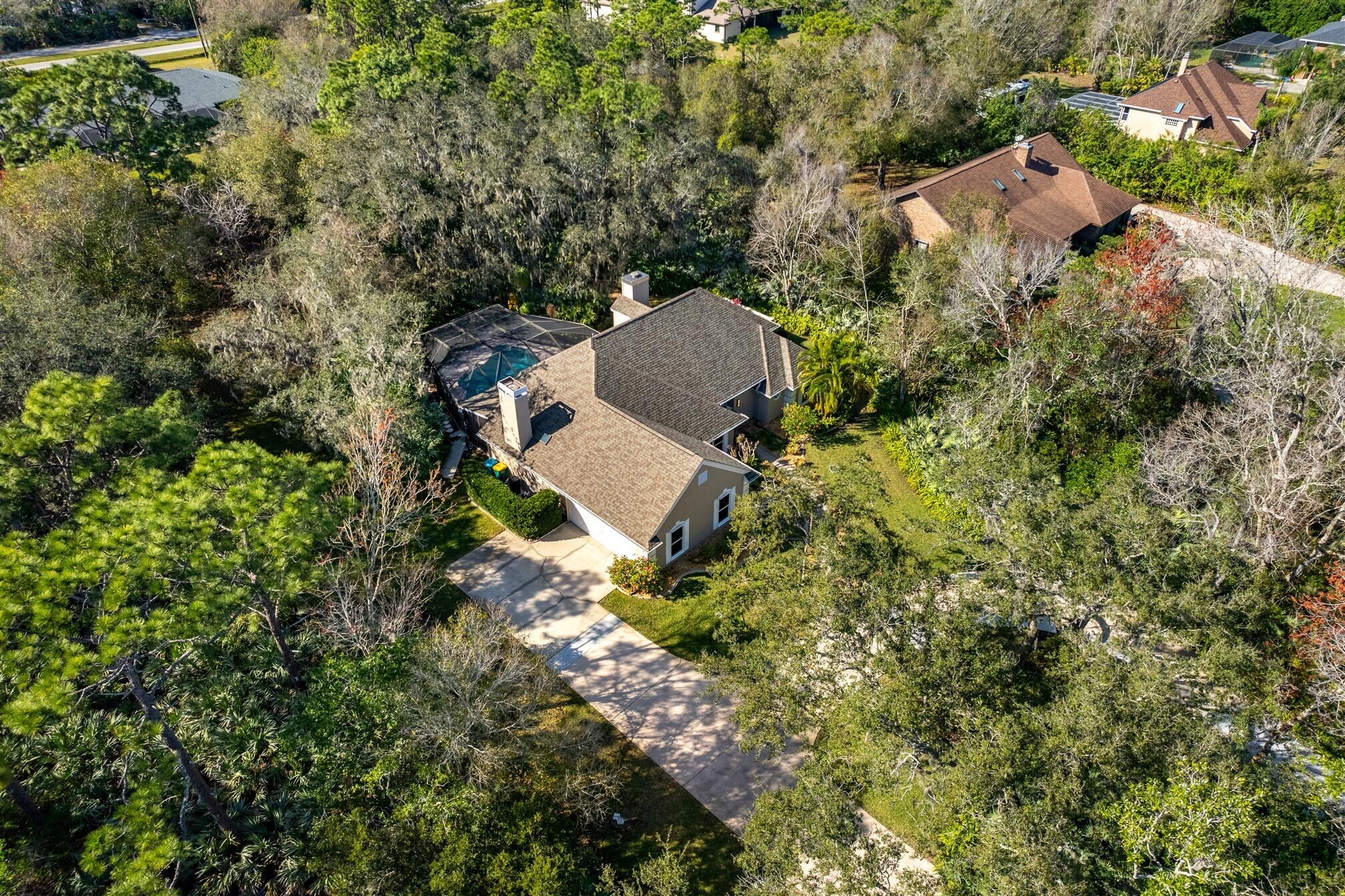 3660 Brennan Drive Melbourne, FL 32934 - Photo 63 of 71 an aerial view of a house with a yard and outdoor seating