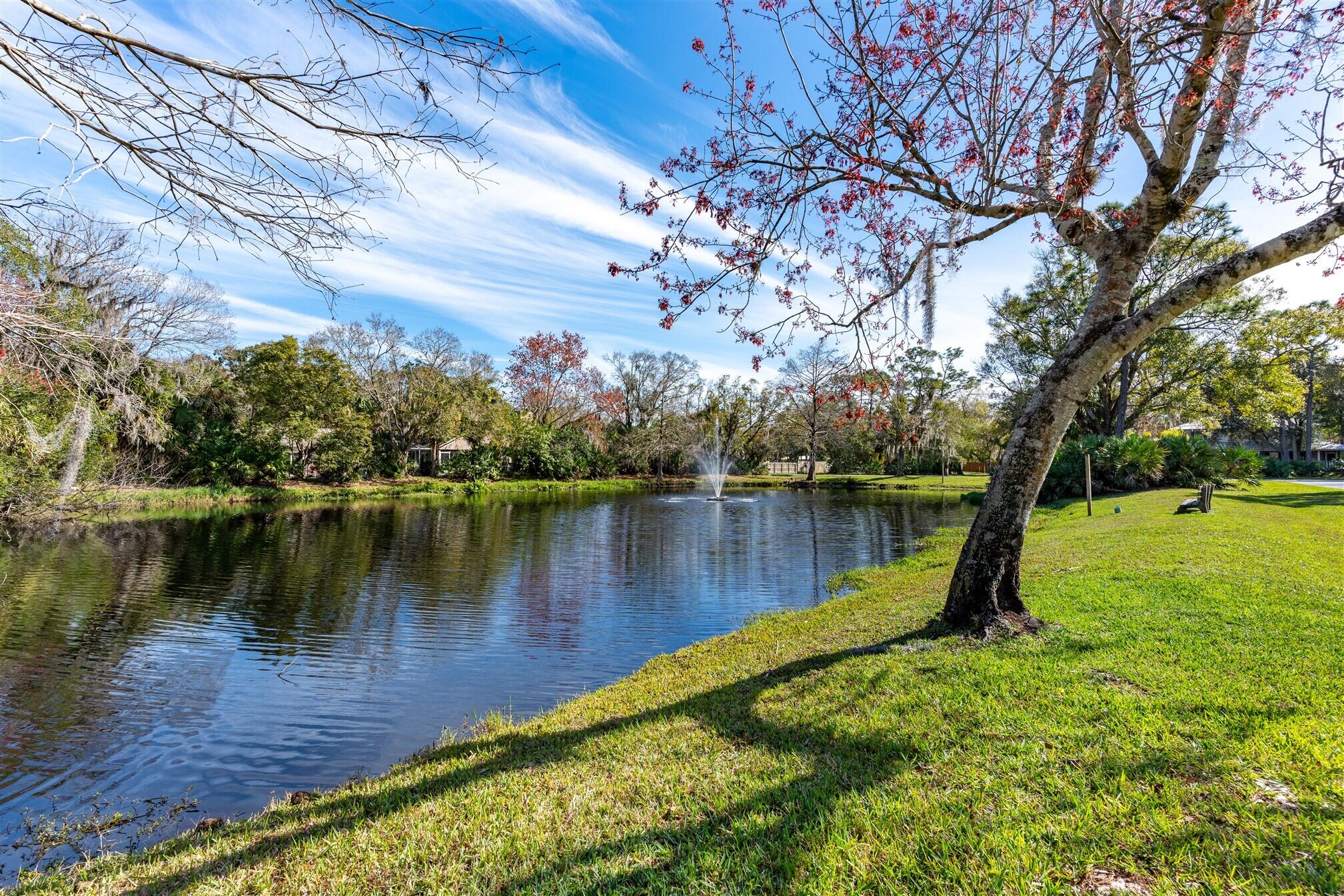 3660 Brennan Drive Melbourne, FL 32934 - Photo 71 of 71 a view of a lake with a garden and trees