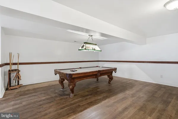 a room with furniture and wooden floor