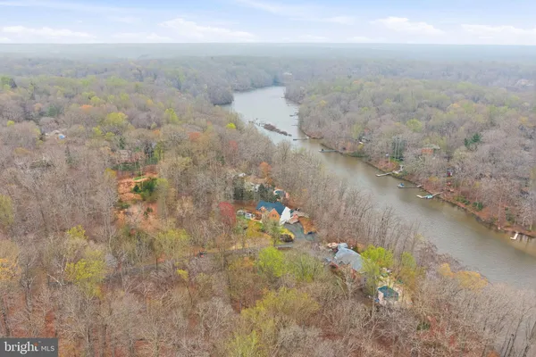 an aerial view of a houses with ocean view