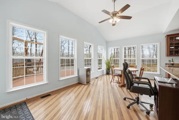 a view of a dining room with furniture window and wooden floor