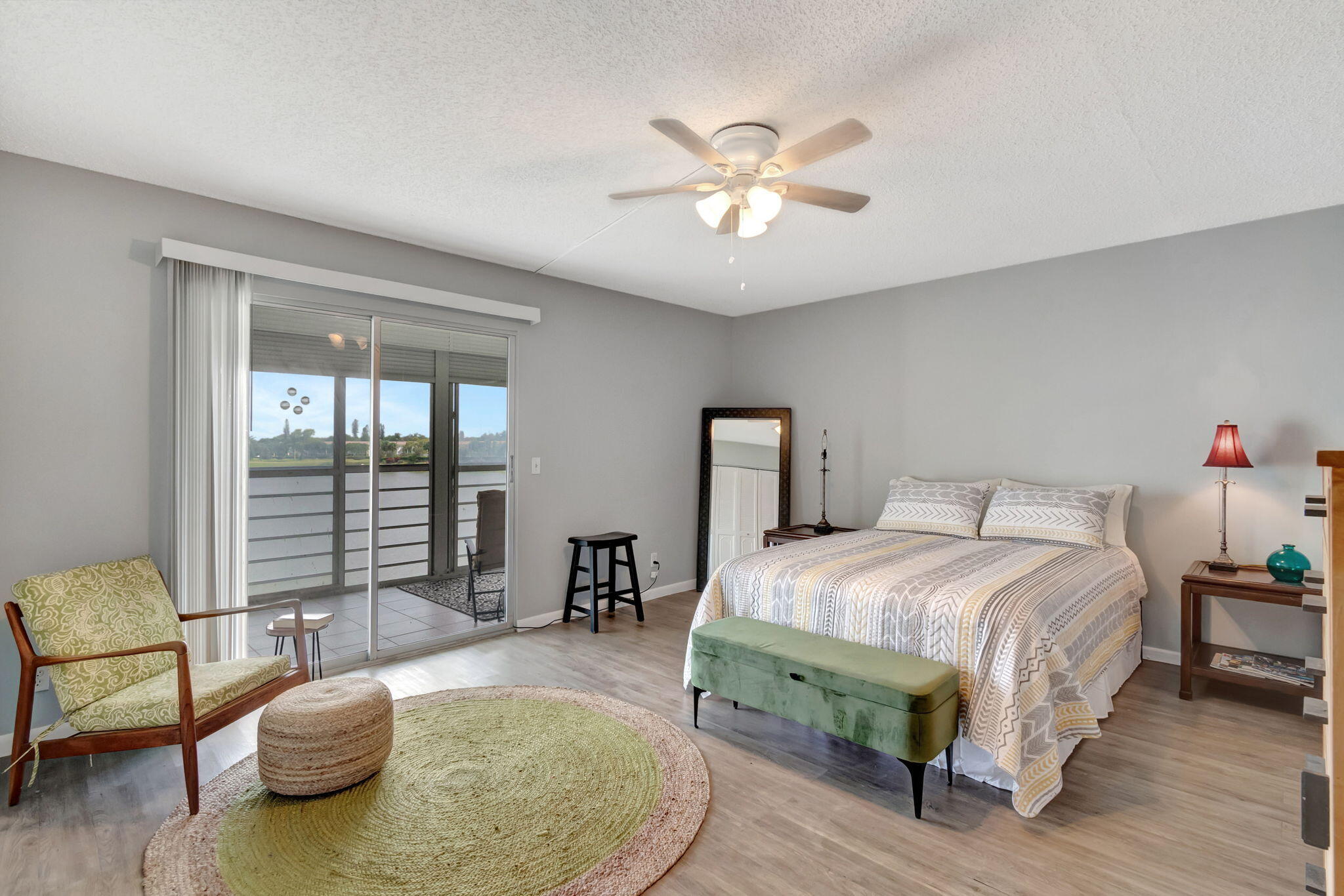 3031 Cornwall East Boca Raton, FL 33434 - Photo 15 of 84 a bedroom with a bed and a chandelier