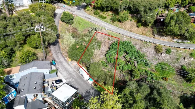 an aerial view of a house with a garden