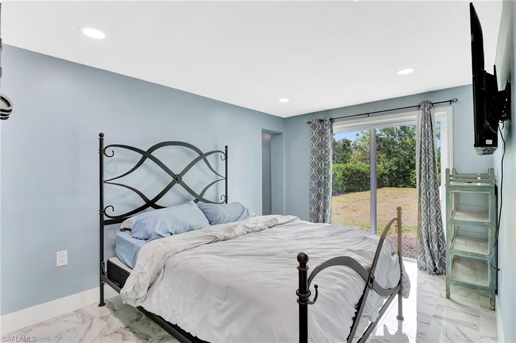 1009 Ridge Street Naples, FL 34103 - Photo 15 of 30 Bedroom with recessed lighting and light marble finish floors