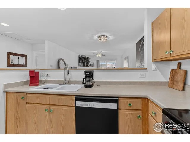 a kitchen with sink and cabinets