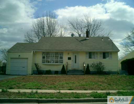 35 Sims Road Edison, NJ 08817 - Photo 1 of 4 a front view of a house with a garden