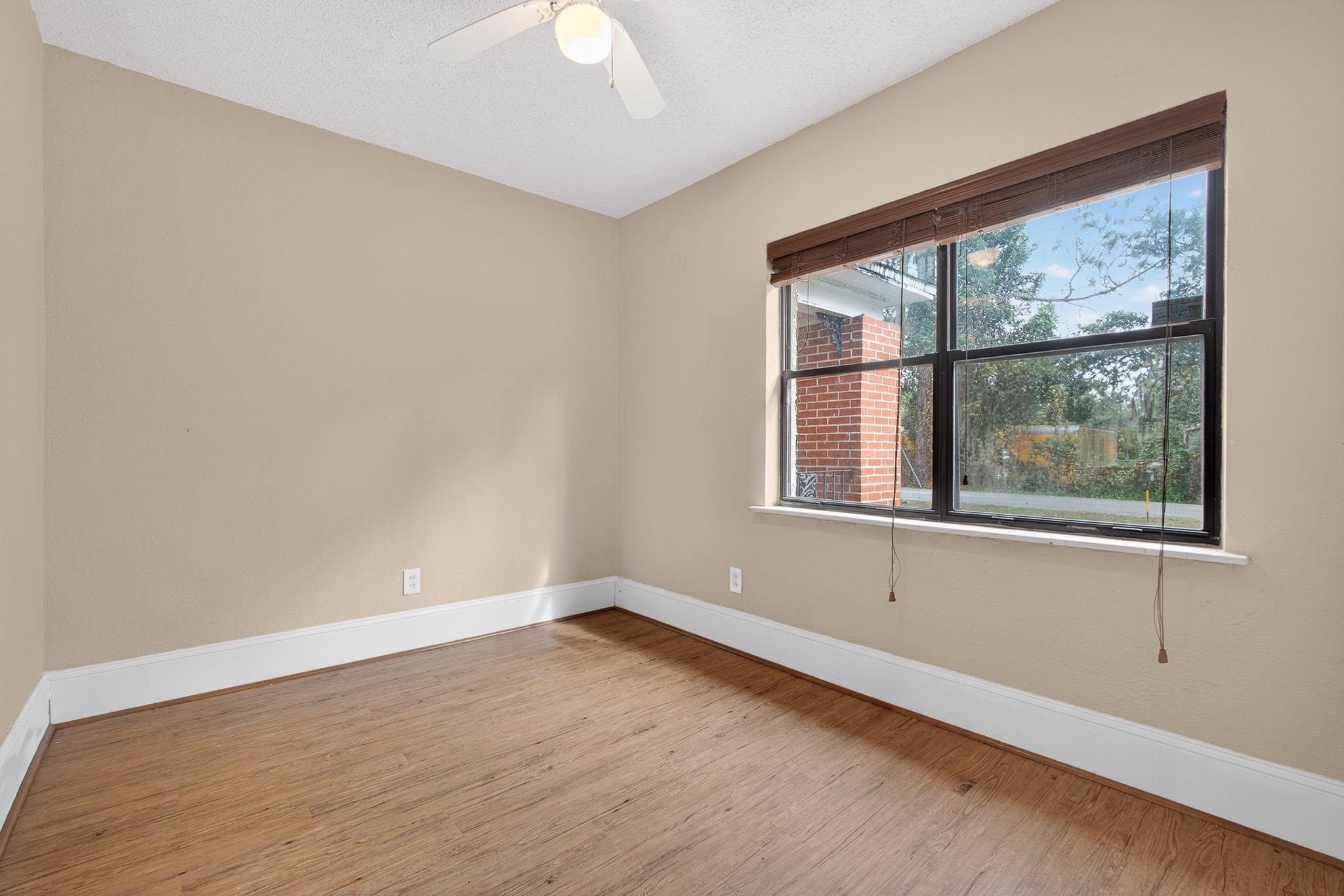 2907 North 5th Street St. Augustine, FL 32084 - Photo 13 of 71 Empty room with wood finished floors and ceiling fan