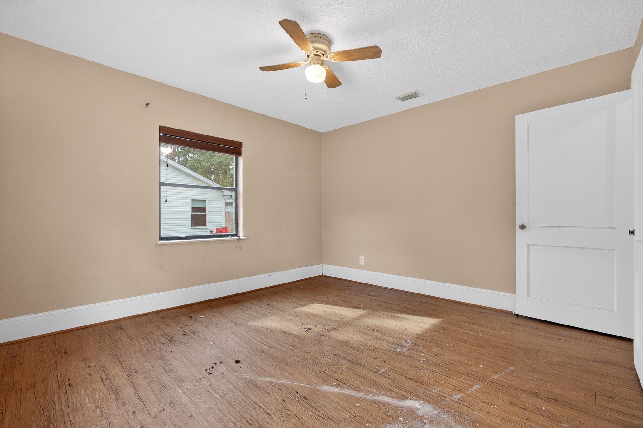 2907 North 5th Street St. Augustine, FL 32084 - Photo 17 of 71 Unfurnished room with wood-type flooring and ceiling fan