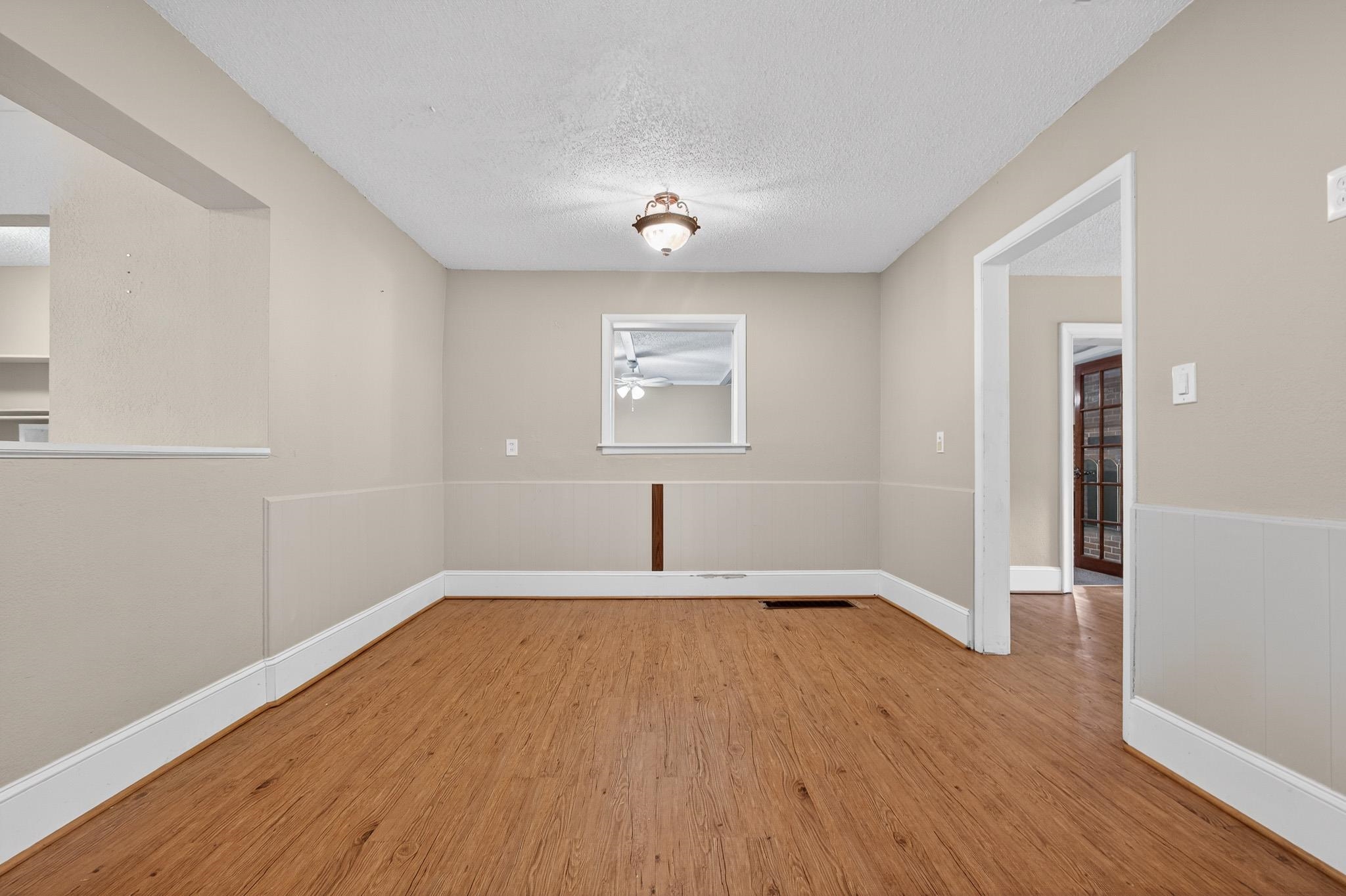 2907 North 5th Street St. Augustine, FL 32084 - Photo 32 of 71 Unfurnished room with light wood-type flooring and a textured ceiling