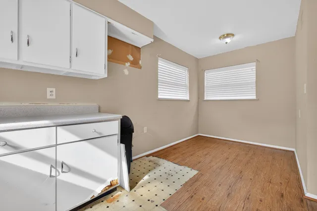 a view of a livingroom with a ceiling fan and window