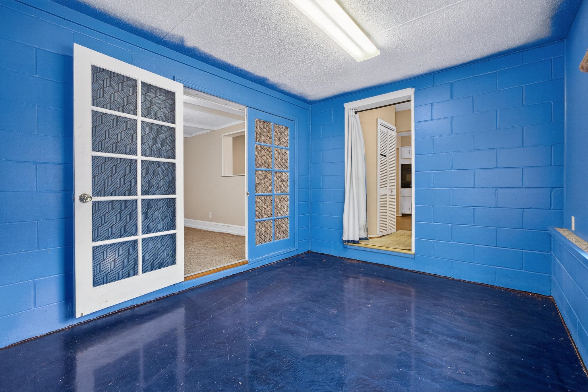 2907 North 5th Street St. Augustine, FL 32084 - Photo 35 of 71 Spare room with concrete block wall and concrete flooring