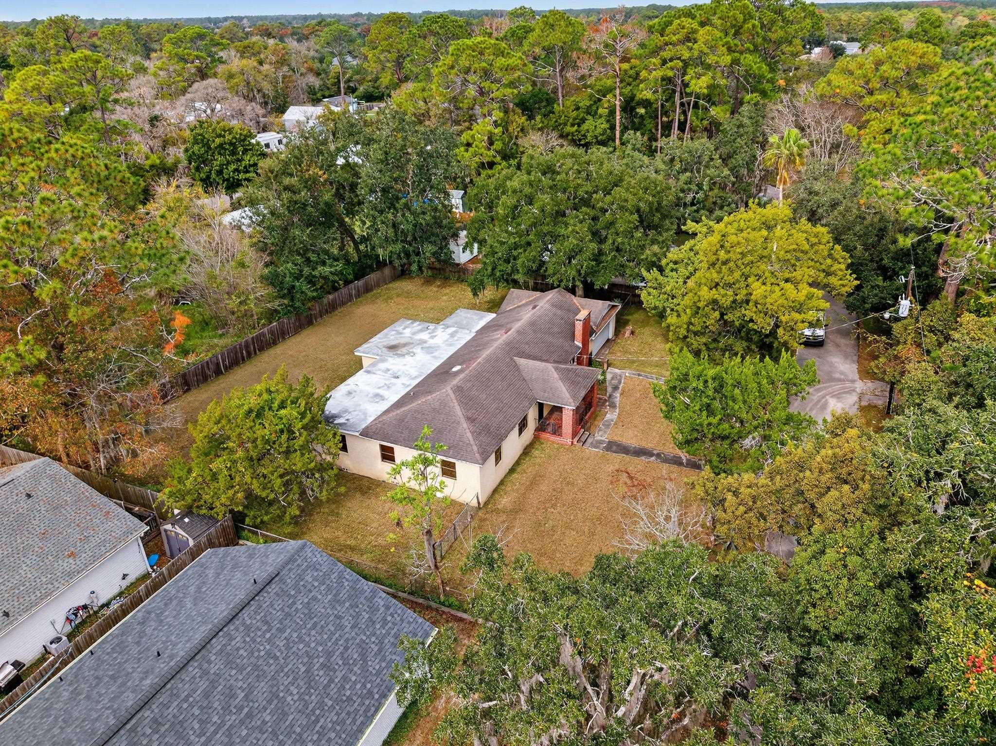 2907 North 5th Street St. Augustine, FL 32084 - Photo 64 of 71 Aerial view of property and surrounding area with a heavily wooded area