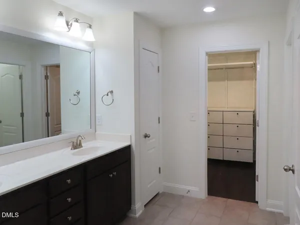 a bathroom with a double vanity sink a and mirror