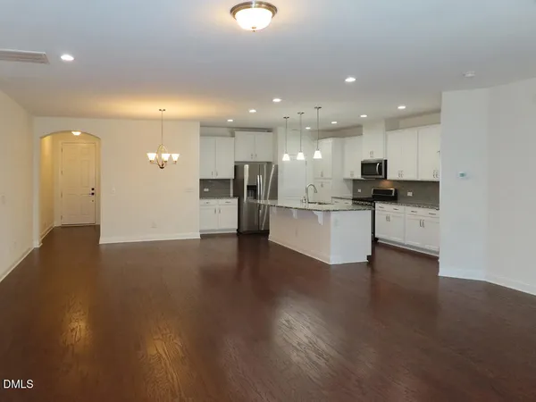 a view of a kitchen with a sink and a stove top oven