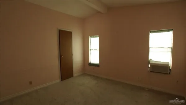 a view of a big yard with large tree