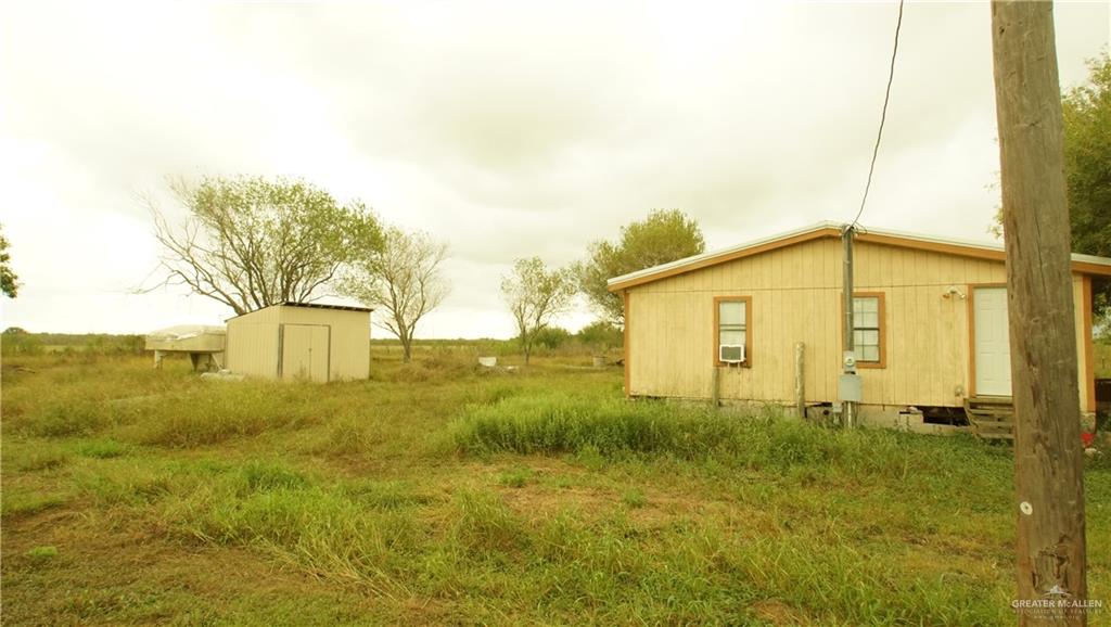 29833 Fernando East Road Rio Hondo, TX 78583 - Photo 14 of 15 a view of a big yard with large tree