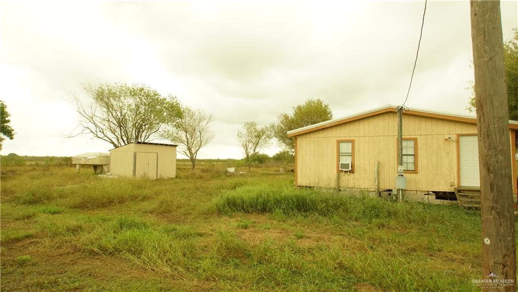 29833 Fernando East Road Rio Hondo, TX 78583 - Photo 15 of 15 a view of a big yard with potted plants