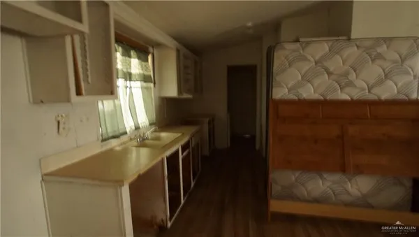 a view of a livingroom with workspace and a couch