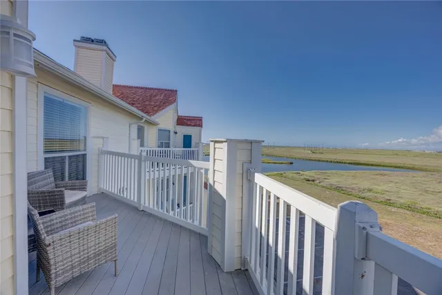 a view of a balcony with ocean view