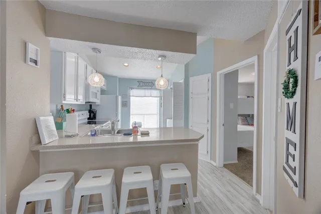 a dining room with a sink and breakfast area