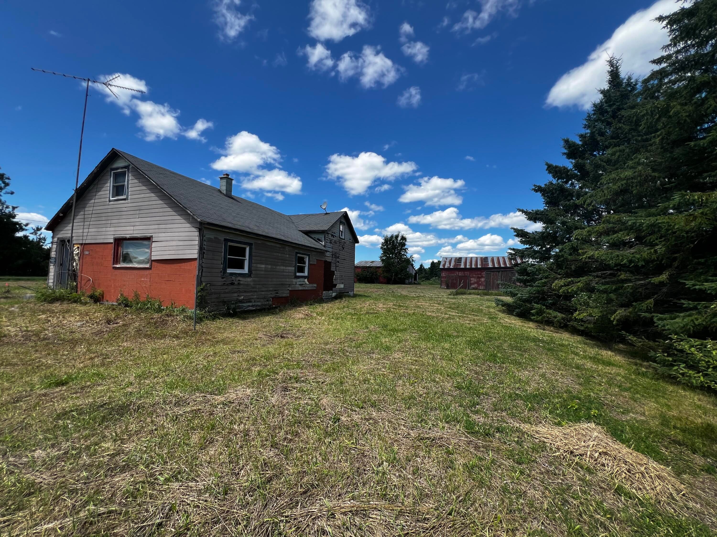 15460 Carney Road Lachine, MI 49753 - Photo 7 of 10 Side of house plus barn