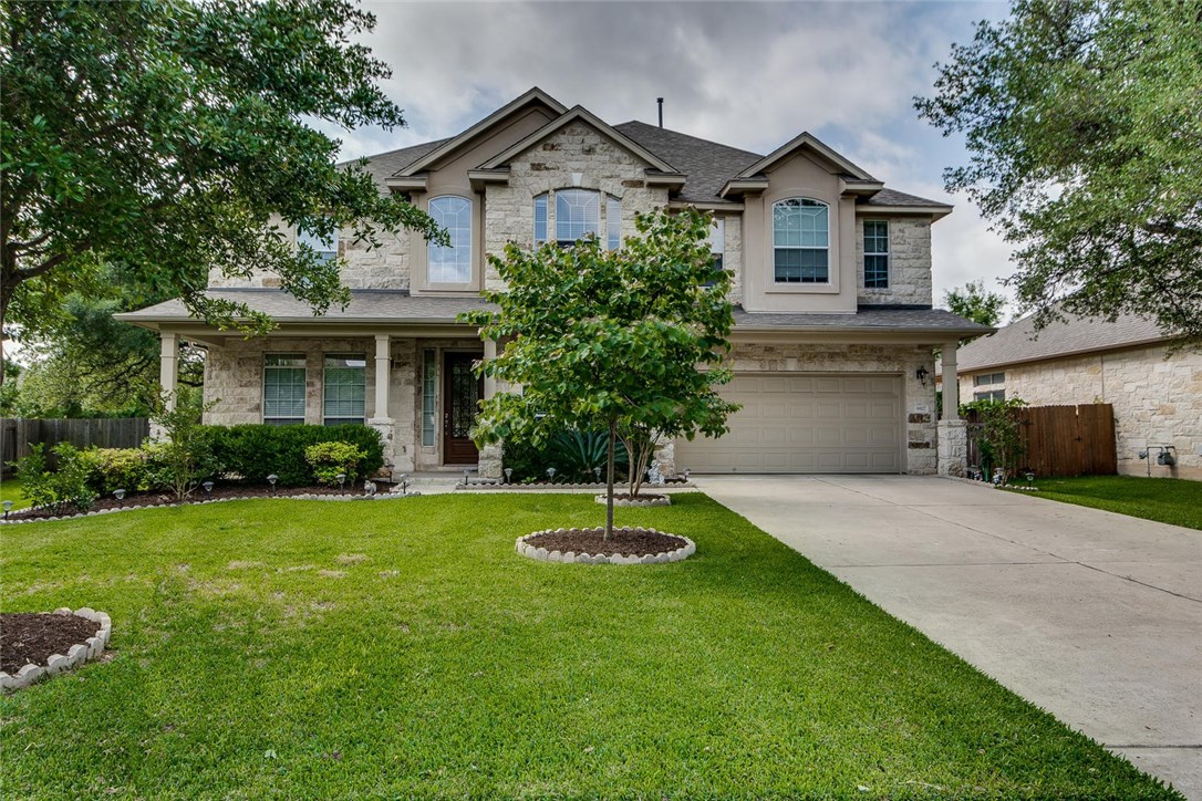 9817 Rias Way Austin, TX 78717 - Photo 1 of 1 a front view of a house with a yard