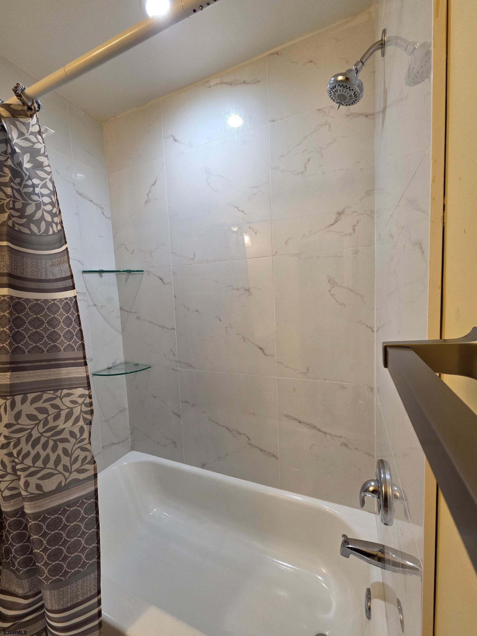 131 Jones Kane Road Williamstown, NJ 08094 - Photo 13 of 18 a bathroom with a bathtub and shower