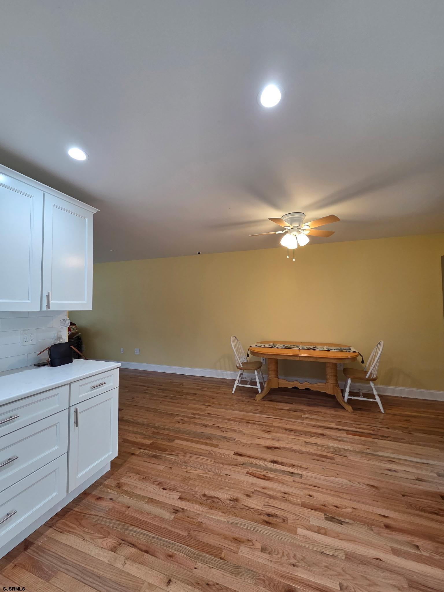 131 Jones Kane Road Williamstown, NJ 08094 - Photo 6 of 18 a living room with kitchen island furniture and a kitchen view