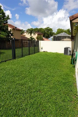 a view of a lake with a house in the background
